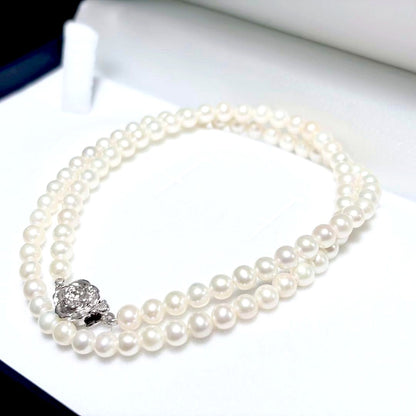 Baby Pearl Akoya genuine pearl necklace with 4.5mm pearls and silver fittings on a white background