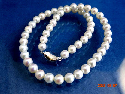 Akoya pearl necklace featuring 7.5-8mm almost round white pearls with pink, blue, and cream hues on a 43cm chain