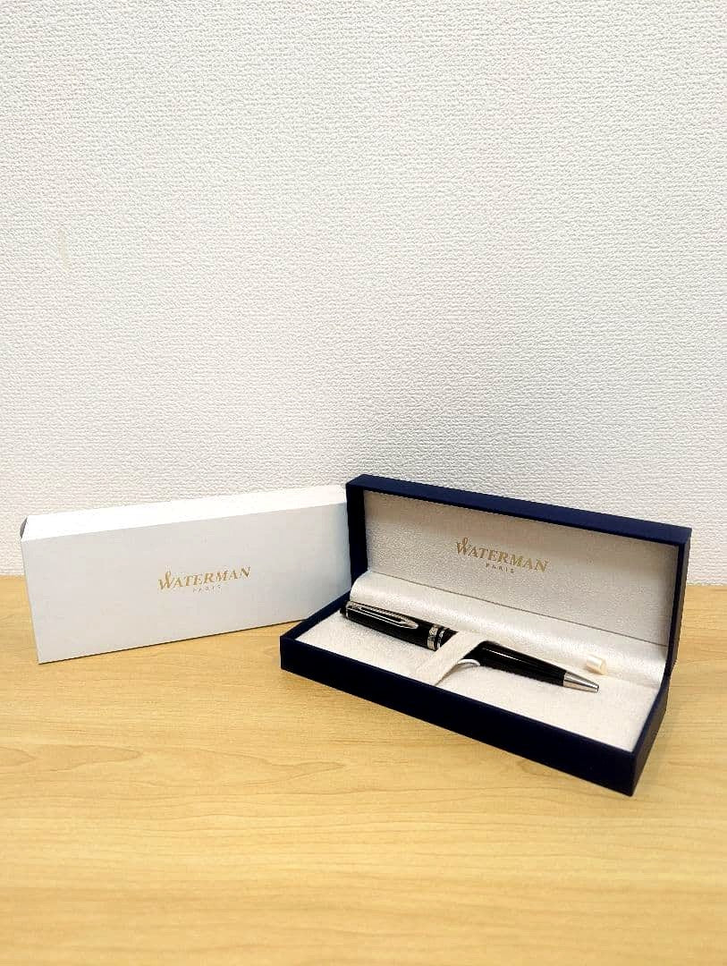 Waterman black and silver ballpoint pen with oil-based ink in a protective case with instruction manual