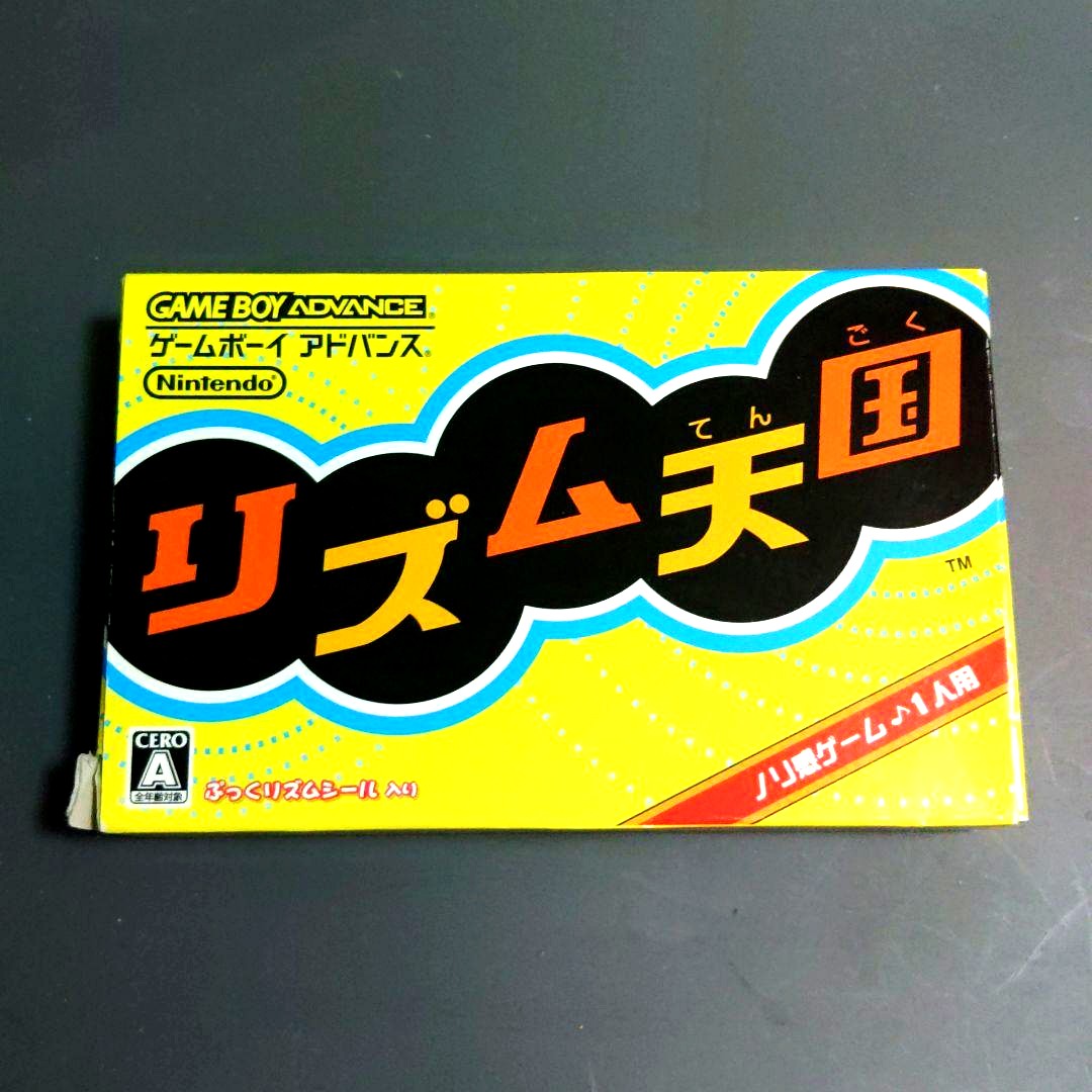 Rhythm Heaven Game Boy Advance GBA game cartridge with instruction manual and Puckered Rhythm Stickers