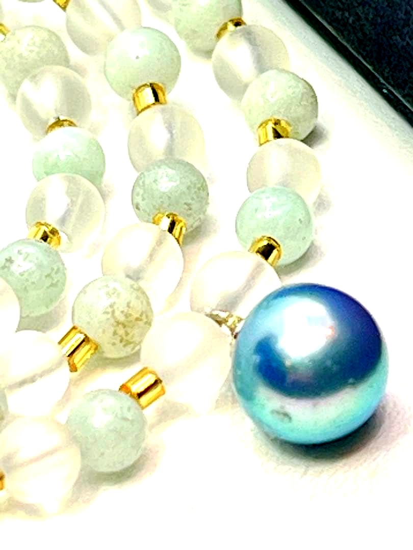 Akoya pearl necklace featuring black pearls, indigo blue pearls, and amazonite beads with adjustable length