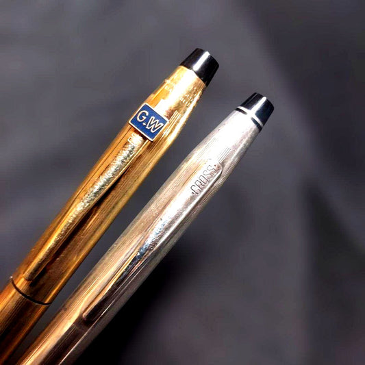 Kinko Plus Cross Ballpoint Pen Set with one gold plated and one silver plated pen displayed side by side