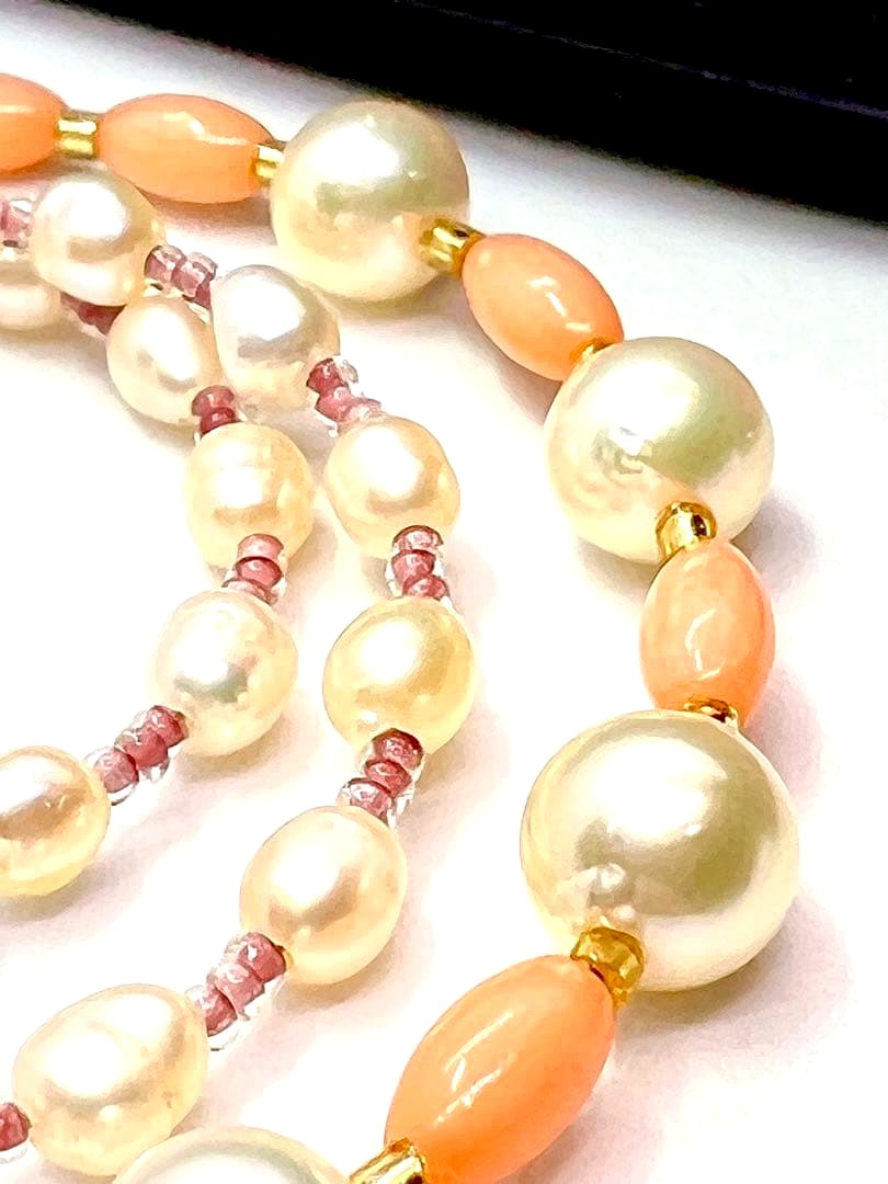 Akoya pearl and pink coral genuine pearl gold necklace with adjustable length and varying bead sizes
