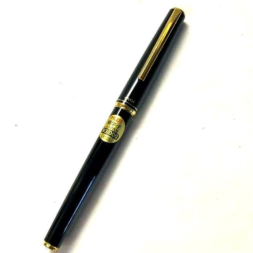 Unused PILOT fountain pen with black barrel and silver clip shown on a white background