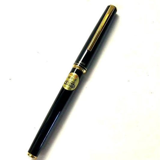 Unused PILOT fountain pen with black barrel and silver clip shown on a white background