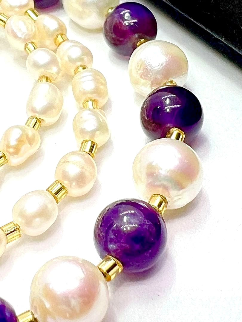 Akoya pearl and amethyst necklace with K18 gold leaf parts on a white background