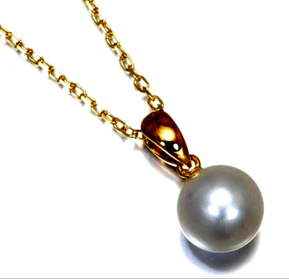 Mikimoto Akoya pearl necklace with a single round 8mm pearl on a yellow gold chain