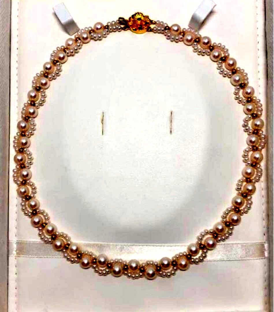 Akoya and freshwater pearl braided necklace with white pearls and silver clasp, approximately 43cm long