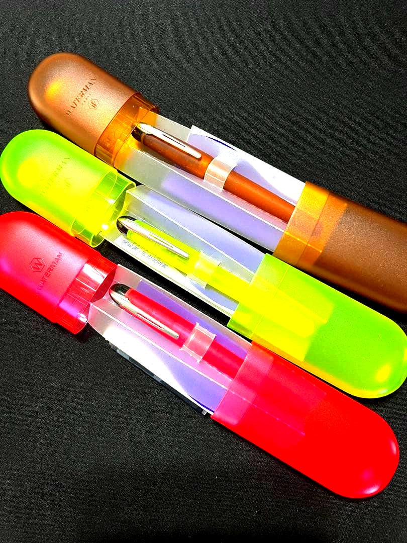 Three Waterman Cultuur Light Soft fountain pens in pink, yellow, and amber with ink cartridges included in original box