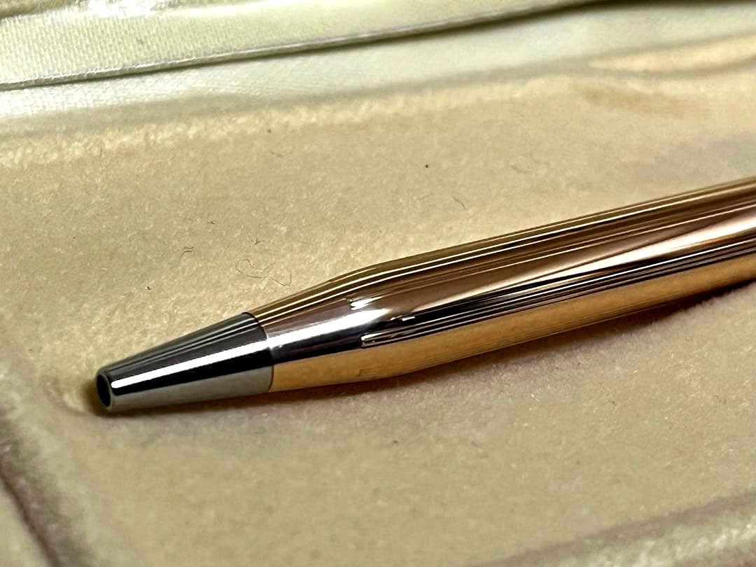 Cross 14K gold plated ballpoint pen with black ink in used condition showing minor scratches