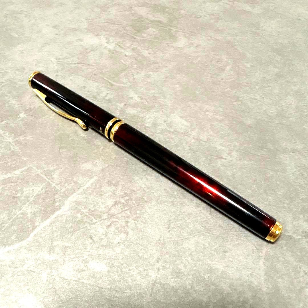 Pilot Cavalier fountain pen in dark brown with gold trim and capped nib on white background