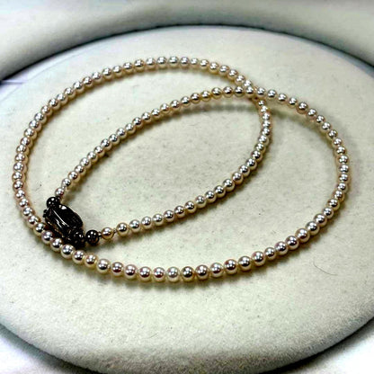 Akoya pearl necklace featuring baby pearls 3-3.5mm with a sterling silver clasp