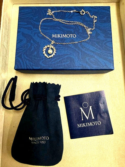 Mikimoto silver pearl necklace with 37.5 cm length displayed on white background