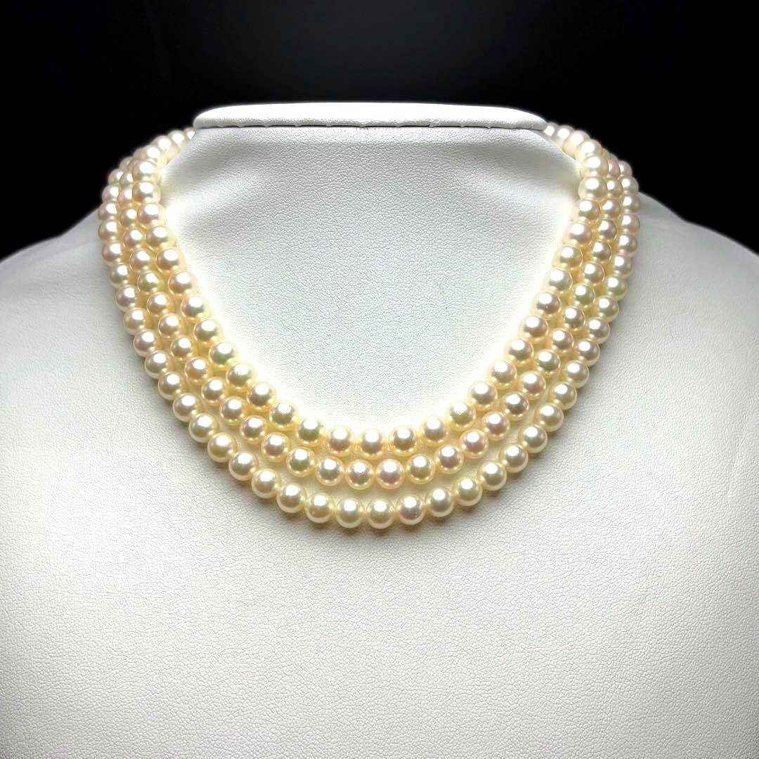MIKIMOTO Akoya pearl necklace with 6.0-6.5mm white pearls and silver clasp on white background