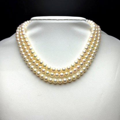 MIKIMOTO Akoya pearl necklace with 6.0-6.5mm white pearls and silver clasp on white background
