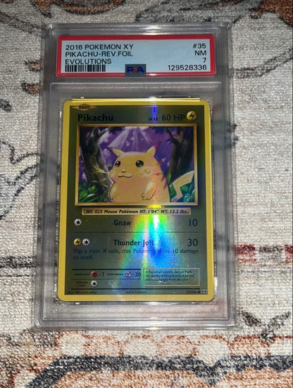 PSA 7 Pokemon Pikachu EVOLUTIONS — English
