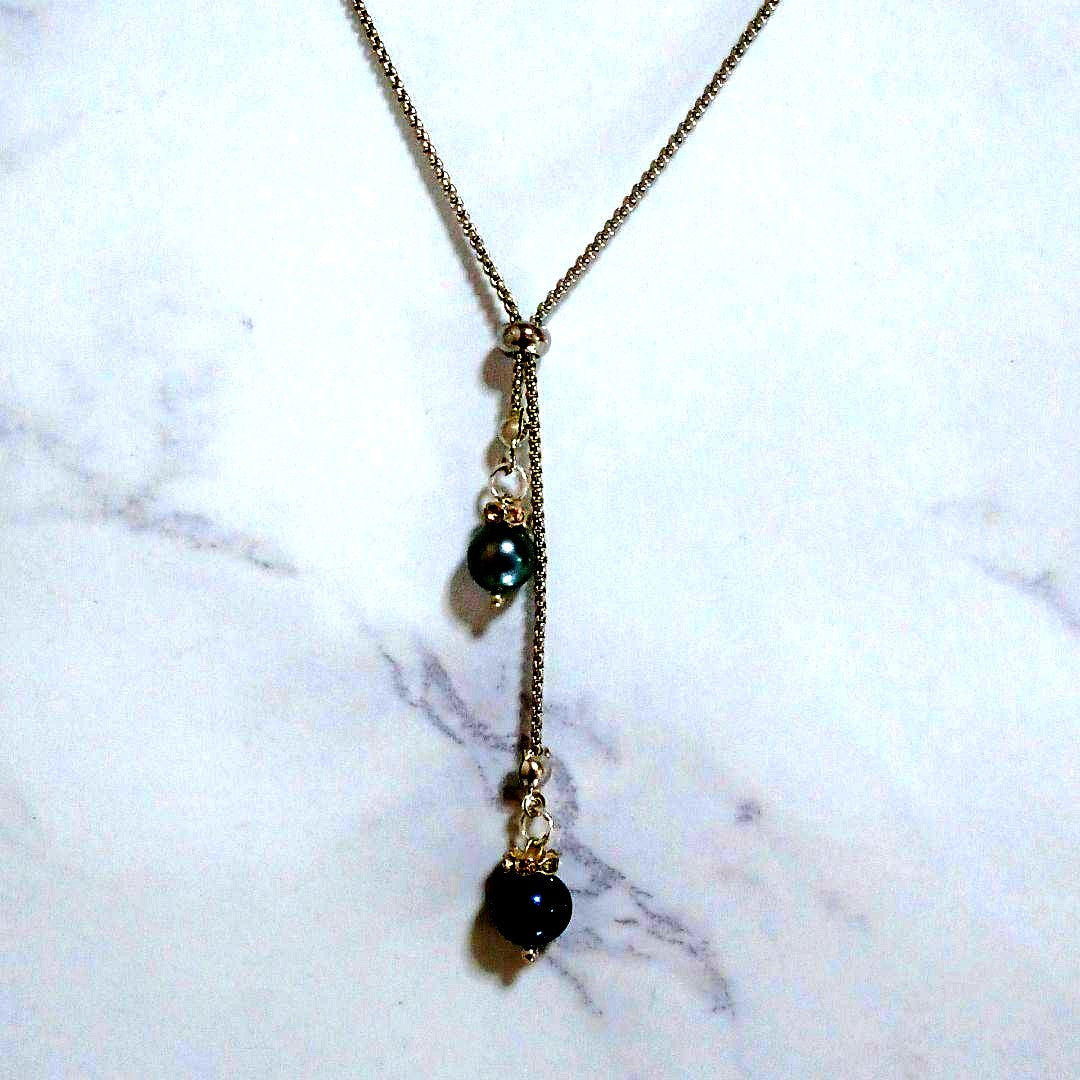 Akoya pearl necklace with slightly round pearls and silver nickel-free clasp on white background