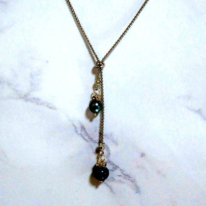 Akoya pearl necklace with slightly round pearls and silver nickel-free clasp on white background