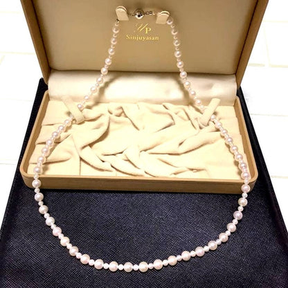 60 centimeter Akoya pearl necklace with pink tone pearls and silver hook closure