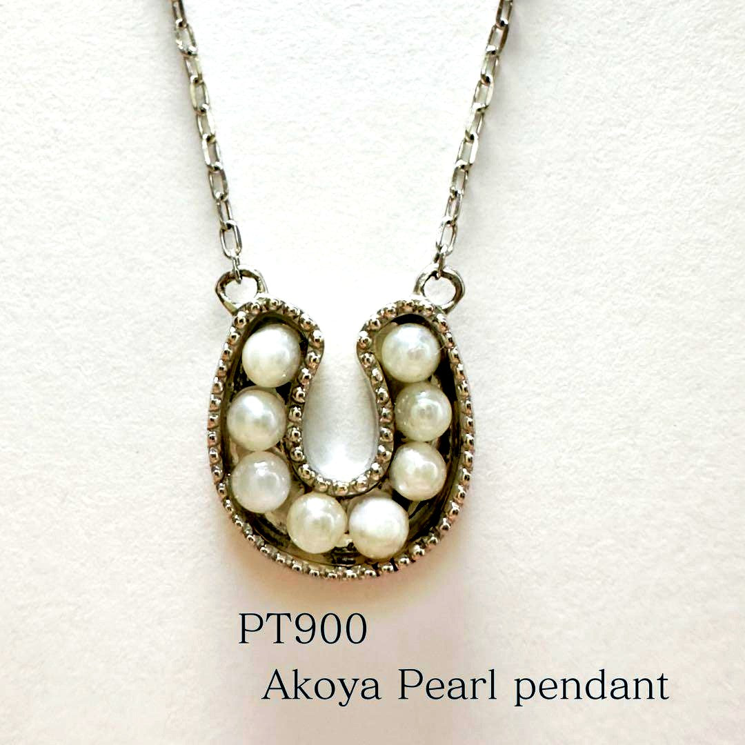 PT900 Akoya Pearl Horseshoe Pendant featuring 8 pearls on a PT850 chain with slide clasp
