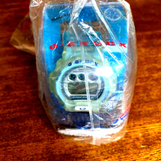 Casio G-Shock DW6900WC-2AT Euphoria Blue digital watch with visible fading and dirt, vintage Japan import