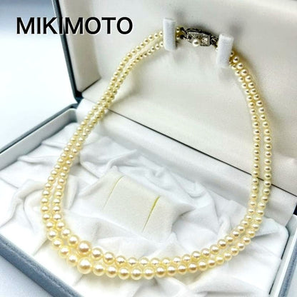 Mikimoto silver double strand necklace featuring gradated Akoya pearls sized 3.5-7.5 mm, 40 cm long