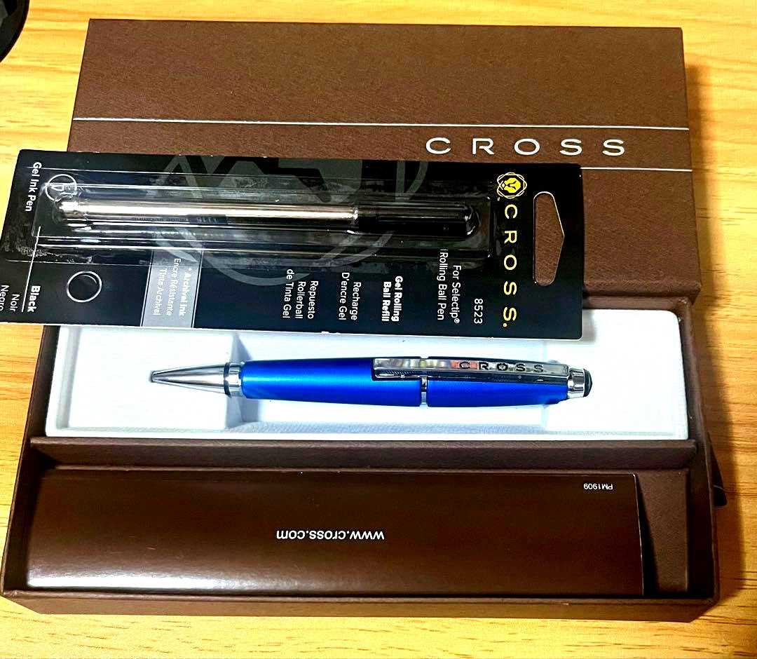 Kuro Cross rollerball pen in blue with included refill, showing a classic design