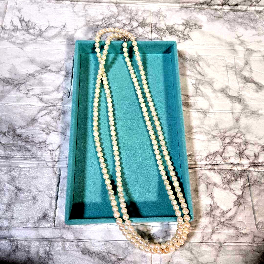 Long Akoya pearl necklace with 6mm genuine pearls on a silver chain measuring 116 cm
