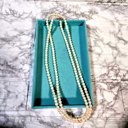 Long Akoya pearl necklace with 6mm genuine pearls on a silver chain measuring 116 cm