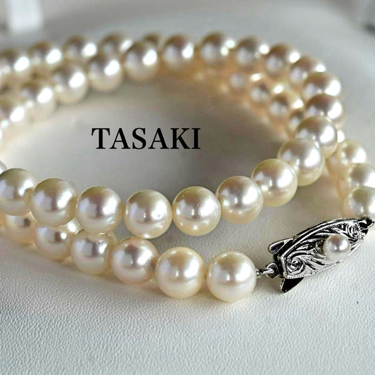 Takatsuki Akoya pearl necklace with 7.0mm round pearls and silver clasp on a white background