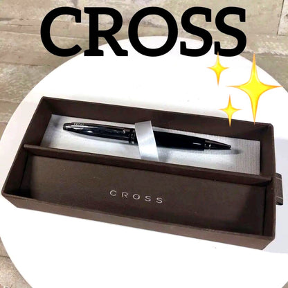 Black CROSS ballpoint pen with its protective case displayed on a white background