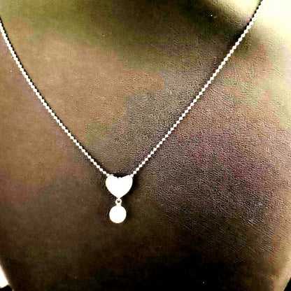Tasaki necklace featuring a small pearl heart pendant on a 40 cm sterling silver chain