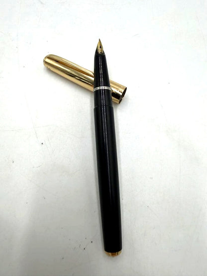 PILOT Fountain Pen with black body and 14K gold accents on a white background