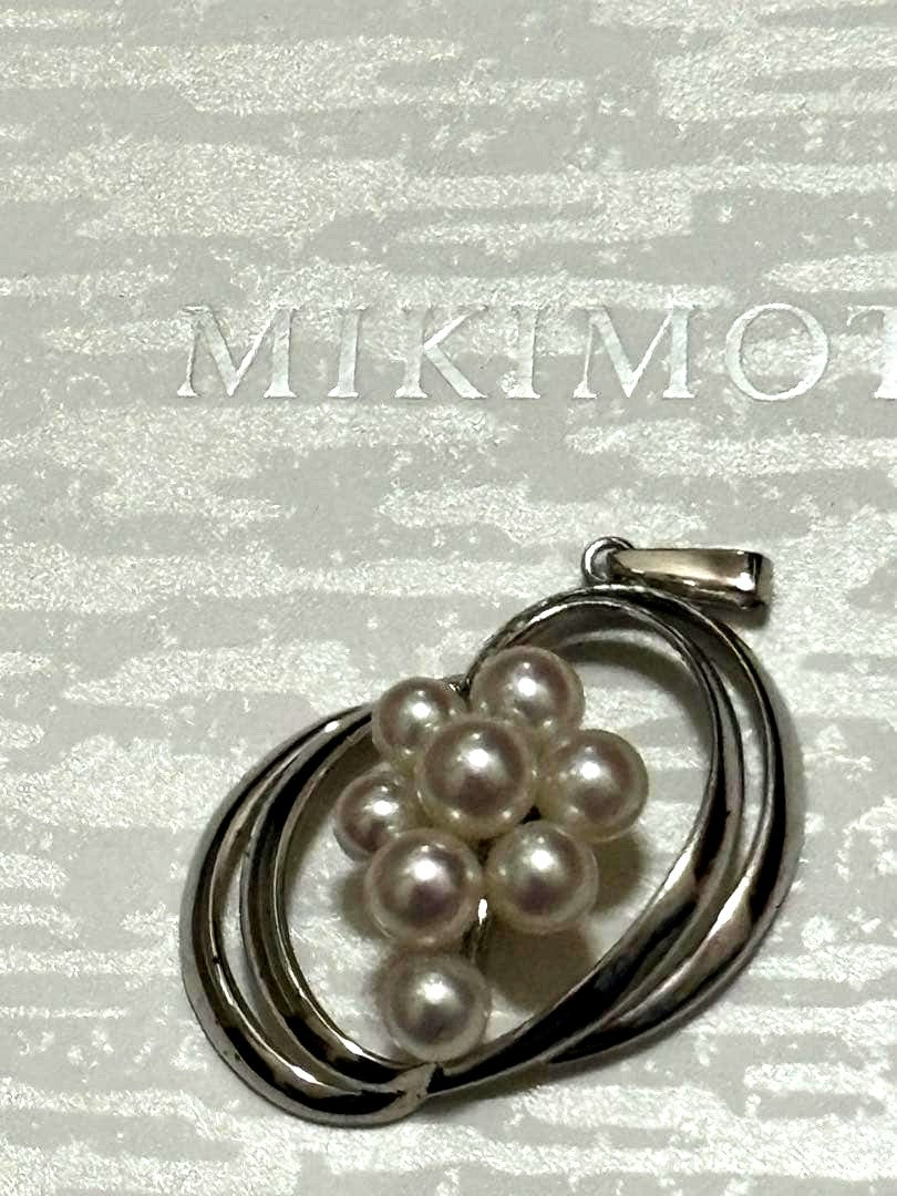 Mikimoto Pearl Pendant Top featuring 8 pearls in a circle motif with silver back stamp