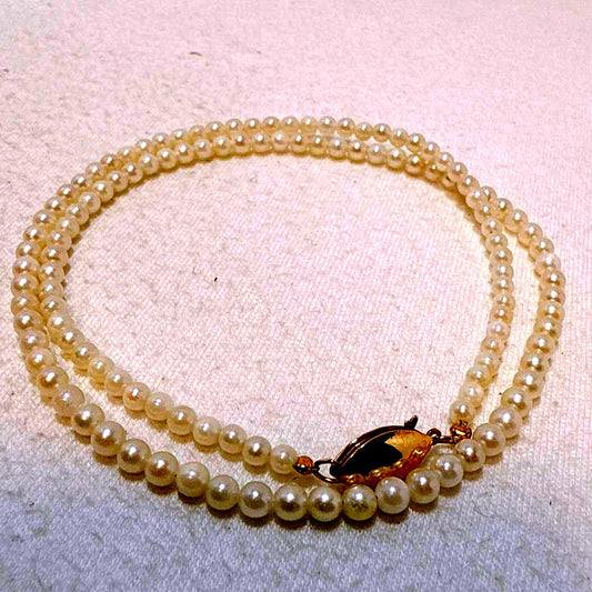 14K gold clasp Akoya baby pearl necklace with 2.8 to 3.3mm pearls on a 40cm chain