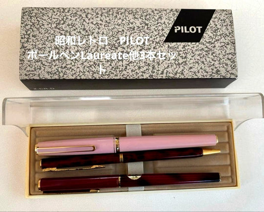 Set of 4 vintage PILOT Laureate ballpoint pens in pink, Bordeaux, and Bordeaux marble colors with visible aging