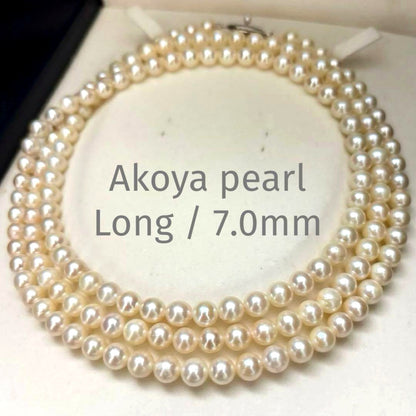 Long Akoya pearl necklace, 108cm length, 7mm pearls, 2-strand design, white pearls on a jewelry display