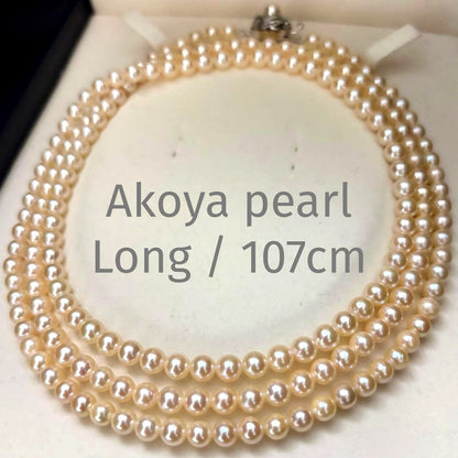 Long 107cm triple-strand Akoya pearl necklace with 6mm white pearls weighing 51 grams