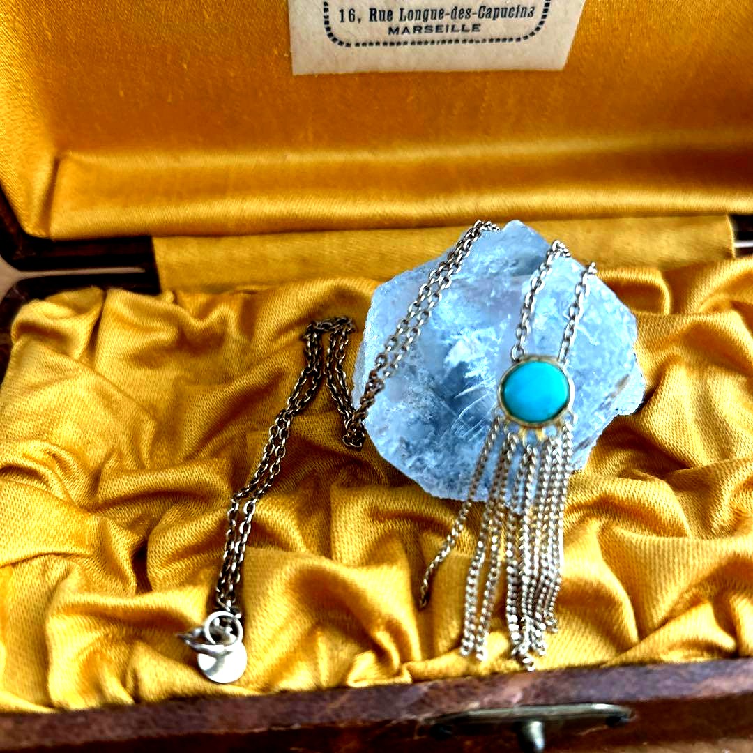 Agot Turquoise silver pendant with round cut stone and gold tone multiple hanging chains in tassel design