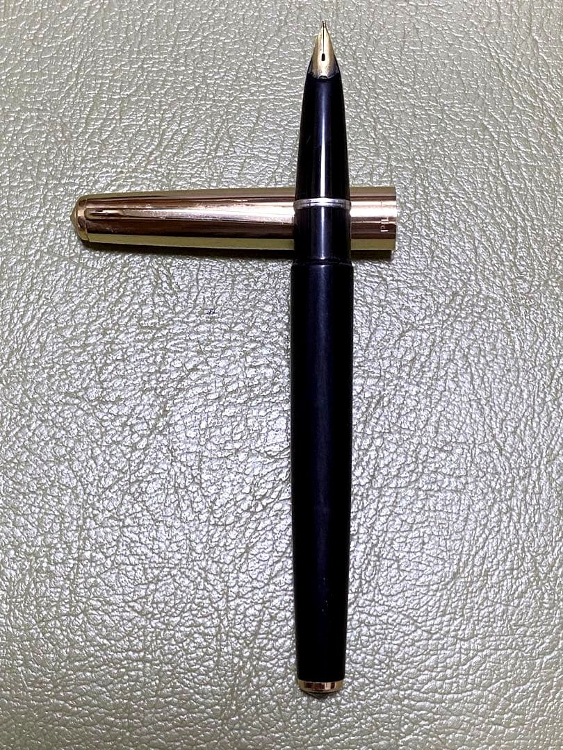 Pilot 14k Fountain Pen in gold finish showcasing nib and cap for premium writing