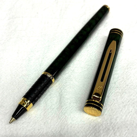 Waterman Exclusive Ballpoint Pen with green marble body, gold trim, and black textured grip
