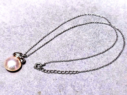 Tasaki Pearl Mabe Pearl silver necklace with a 42cm chain and detailed top shown