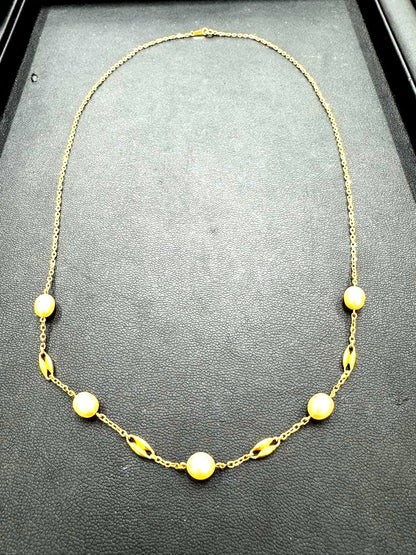 MIKIMOTO pearl necklace made of yellow 18K gold, 50 cm length, displayed on a white background