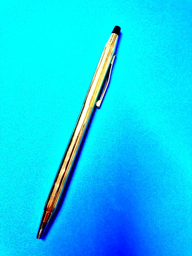 Cross Gold ballpoint pen slim type with black ink, sleek gold finish, used excellent condition