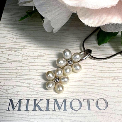 Mikimoto silver flower pearl pendant top with Perleita service chain, 34.1mm height, 15mm width, weighing 3.41g