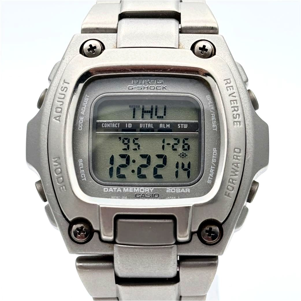Casio MRG-210T vintage digital watch with 42mm stainless steel case showing signs of use