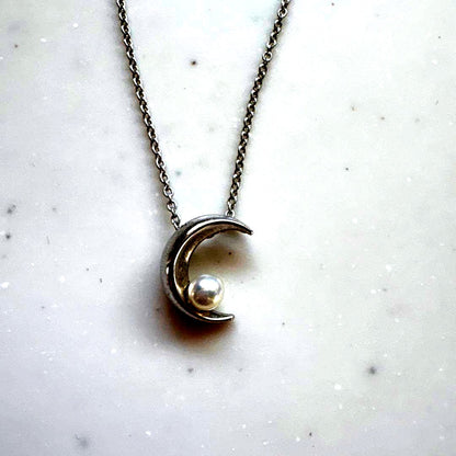 Tasaki Baby Pearl and Moon Necklace featuring silver moon pendant and lustrous pearls