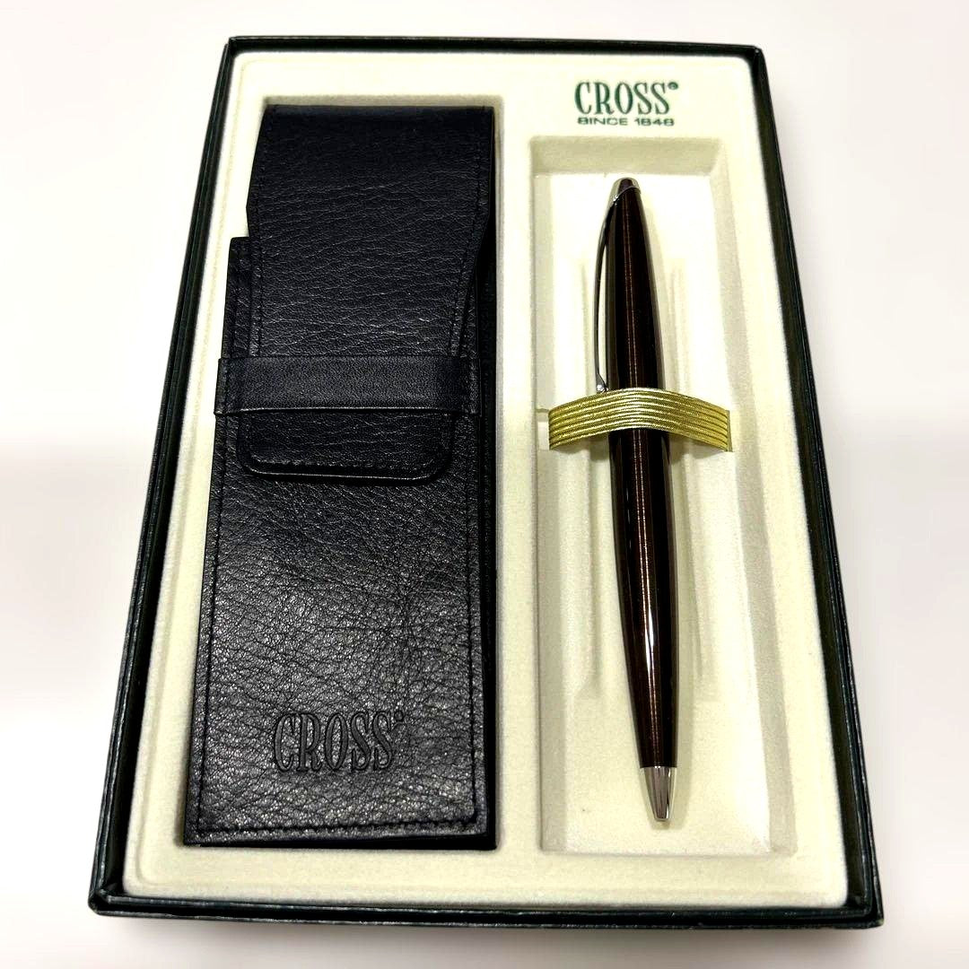 Cross brand ballpoint pen with genuine leather case shown on a white background