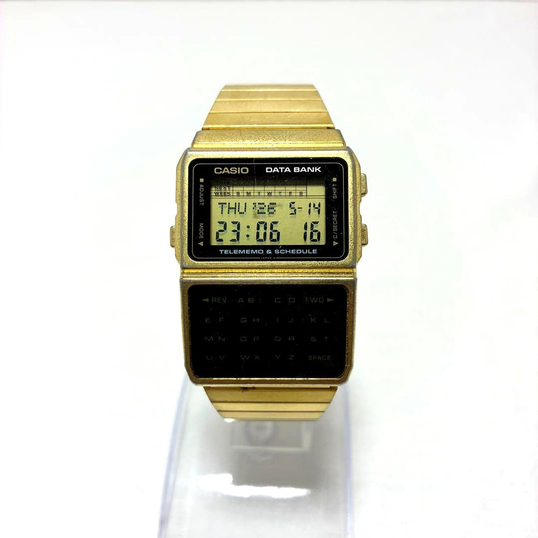 Casio Data Bank DBC-610 gold watch with genuine belt showing retro calculator and digital display