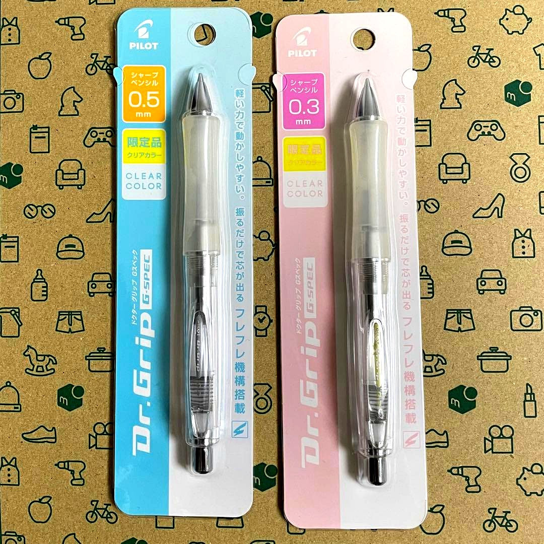 Two Pilot Dr.Grip G-spec Non-Color Clear pens showing 0.3mm and 0.5mm tips in clear casing